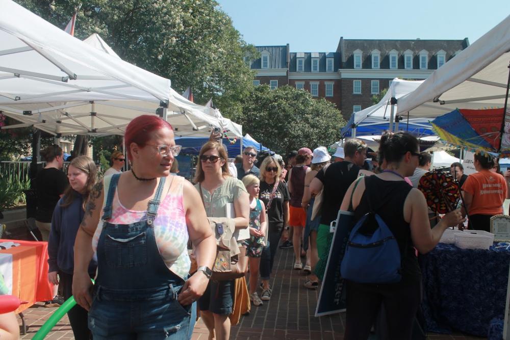 People walking between tents at Alexandria Pride 2025