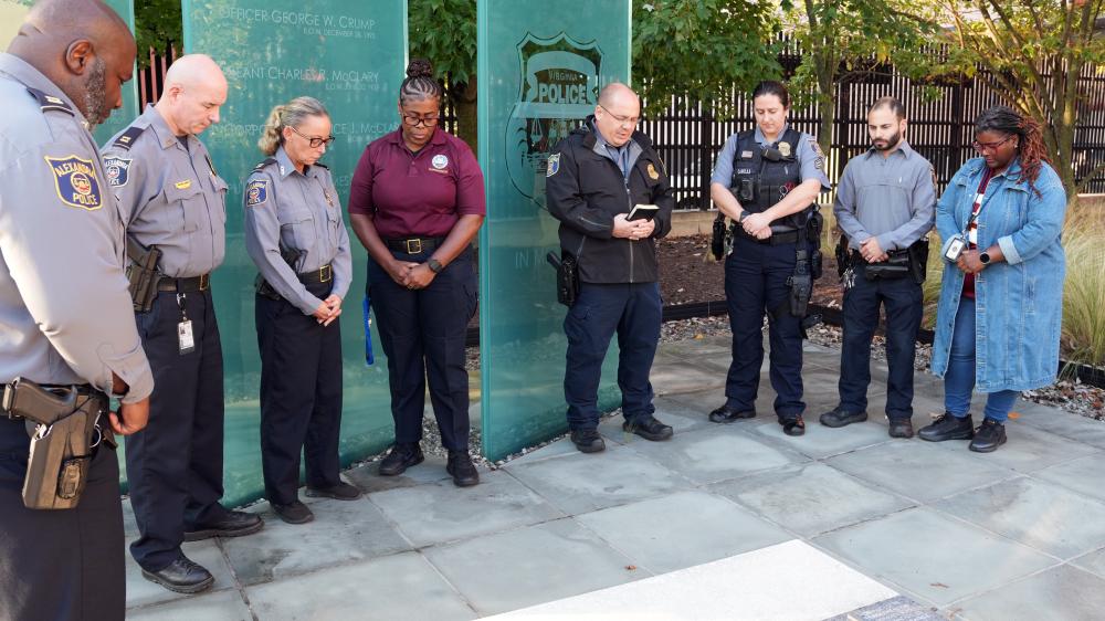 APD officers and professional staff pause together in prayer and remembrance, honoring fallen colleagues as part of Faith & Blue.