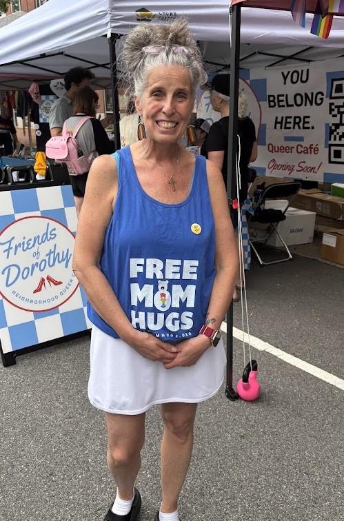 Person wearing "free mom hugs" shirt