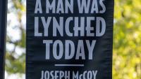 Banner in honor of Joseph McCoy, "A Man Was Lynched Today" (2021)