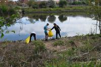 Residents participate in a stream clean-up during Earth Month 2023