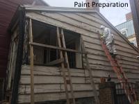 paint preparation -- man on ladder