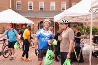 Cyclists enjoy free coffee and goodie bags at the Market Square Bike to Work Day pit stop.
