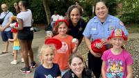 Two deputies, one firefighter and three kids -- all female -- at a National Night Out event in Lyhaven