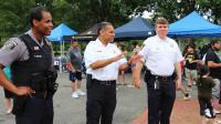 Police commander, Fire Chief and Sheriff smiling at National Night Out even in Chirilagua