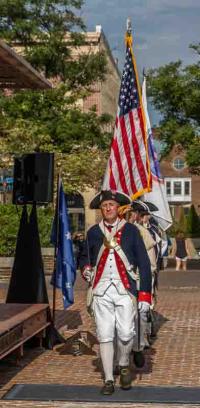 Colonial reenactors with flag