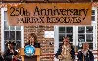 Gretchen Bulova at podium, speaking to audience