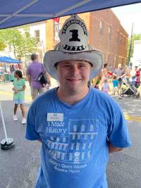 junior docent in Gadsby's t-shirt and fire hat