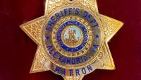 seven point gold tone badge for "Matron for "Sheriff's Dept" in "Alexandria, VA" with seal of the Commonwealth of Virginia in center, on a red velvet background