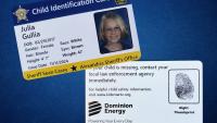 A sample photo identification card with personal information and a child's face on one card and helpful tips and a fingerprint on the other card.