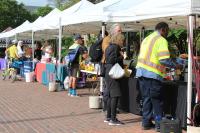 Cyclists at vendor tables