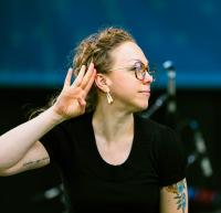 The ASL interpreter signing a word