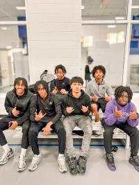 Group of teenage boys posing for the camera and smiling