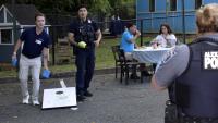 APD Officers play cornhole with Alexandrians during a Child and Family Outreach event September 9, 2025.