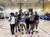 Teenagers posing for the camera inside the Charles Houston Rec Center