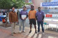 City staff at registration table for the Old Town Pitstop