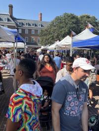 People walking between tents at Alexandria Pride 2025