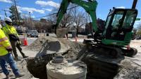 A new manhole is installed at the intersection of N Alfred St & Princess St