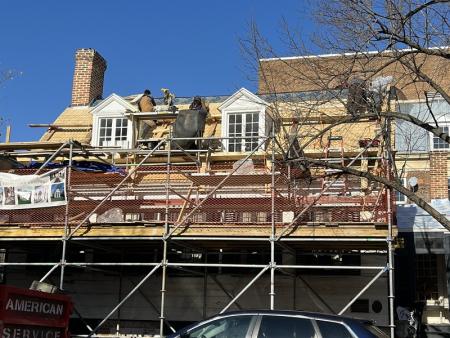 Installing the wood shingles on the oldest section of the house