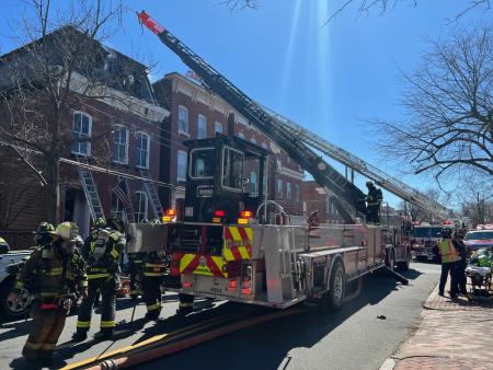 Firefighters respond to a residential building fire in the 200 block of S. Fairfax St. on Wednesday, March 15, 2023.