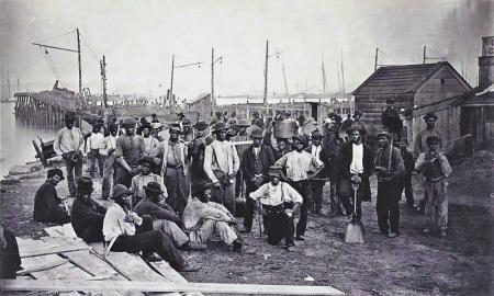 Laborers in front of coal wharf