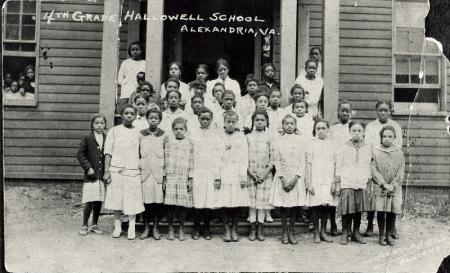 Girls in front of school entrance