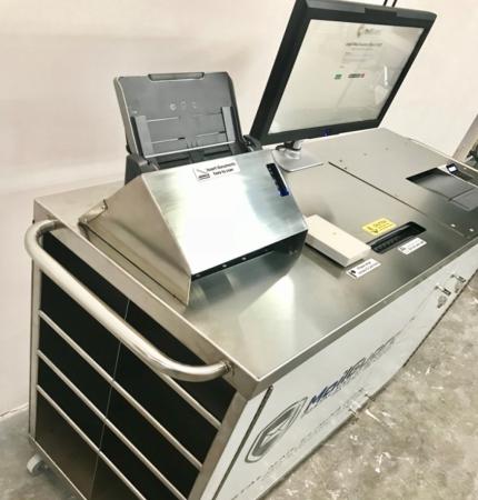 silver metallic cart with scanning equipment from Smart Communications