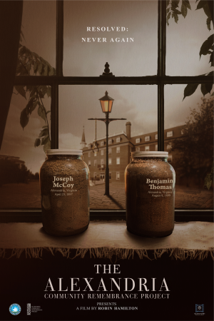 Two jars of soil with the names of Joseph McCoy and Benjamin Thomas on a windowsill in front of City Hall