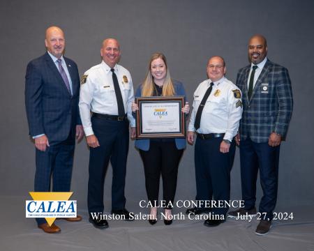 Chief of Police with CALEA Commission with certificate