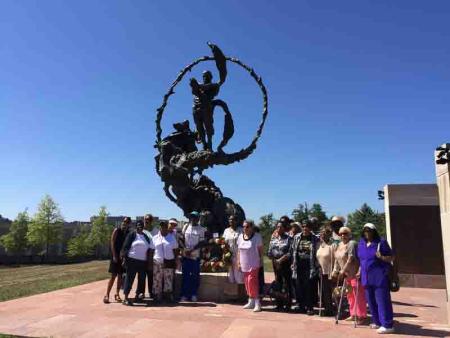 people gathered around statue