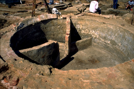 Excavated circular brick cistern with multiple interior chambers