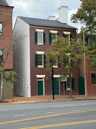 Freedom House Museum after exterior renovation, with dark red paint and green shutters