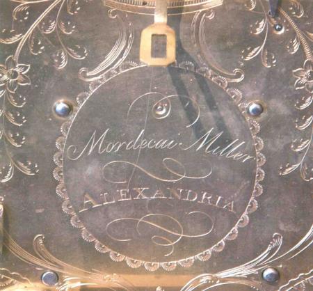The clockworks are engraved Mordecai Miller/Alexandria, within a decorative wreath.