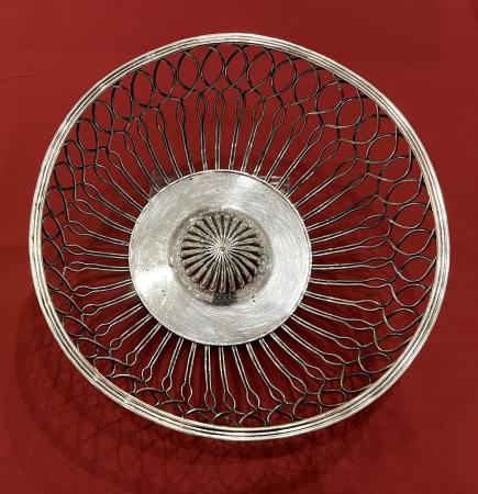 Round silver openwork basket.