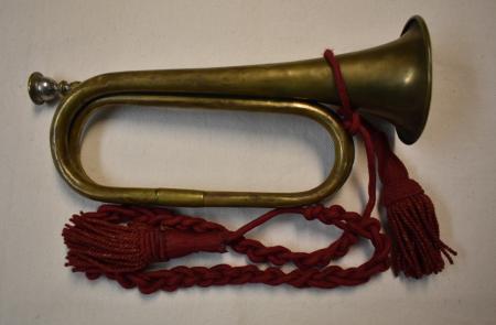 A Civil War era bugle from the collection of Fort Ward Museum is ornamented with red tassels.