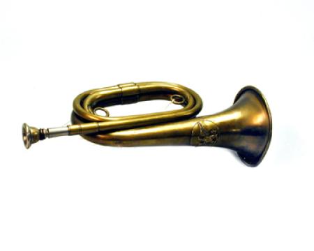 Copper bugle with a crest near the flared bell.