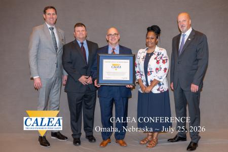 Alexandria Sheriff's Office Employees Stand with CALEA Officials for a Group Photo