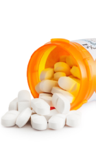 An orange pill bottle with white pills