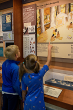 Young visitors point to an archaeology exhibit at the Buddie Ford Nature Center.