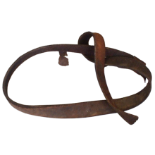 Curled leather strap, approximately one inch wide and two feet long