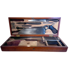 Open surgical kit showing instruments in designated compartments