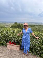 woman outdoors with a blue dress