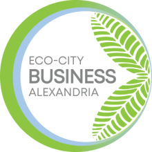 circular logo of Eco-City Business with green leaves