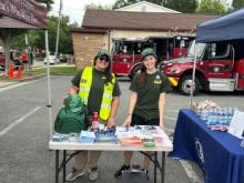 two volunteers tabling at the event 