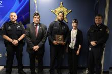 Deputy Cromer standing with 4 other people after receiving award