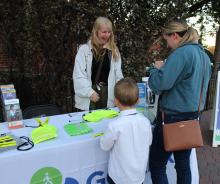 staff with two residents tabling